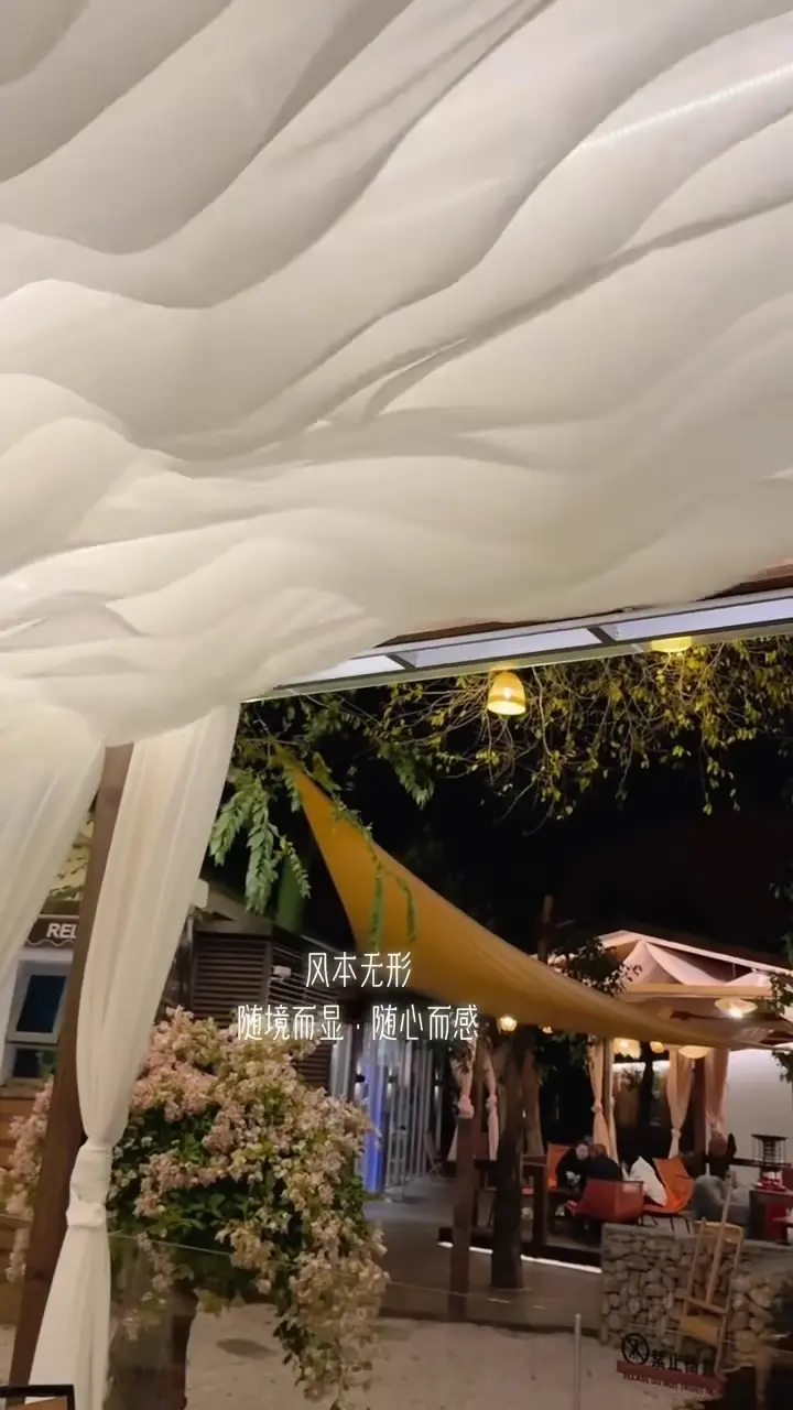 Fabric wave ceiling installed in an indoor event space