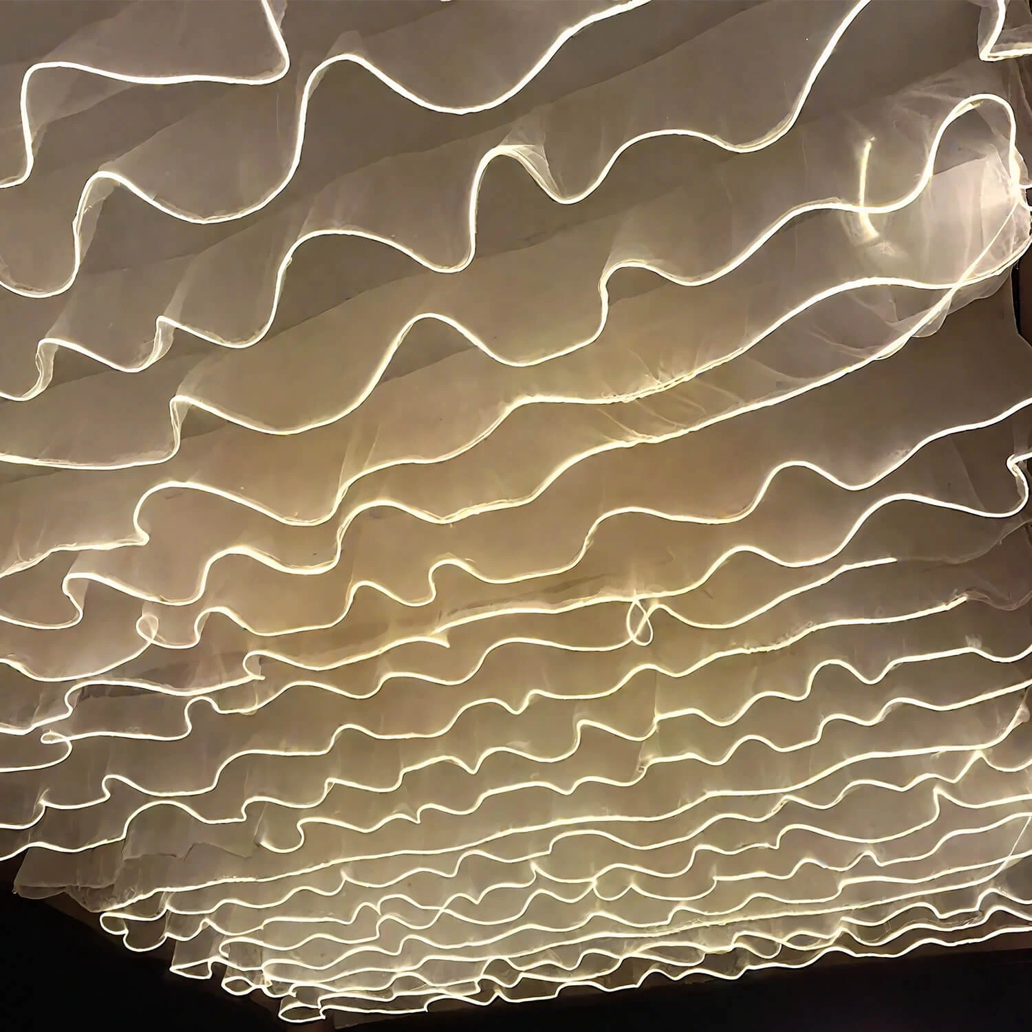 Illuminated ivory fabric wave ceiling, product photograph